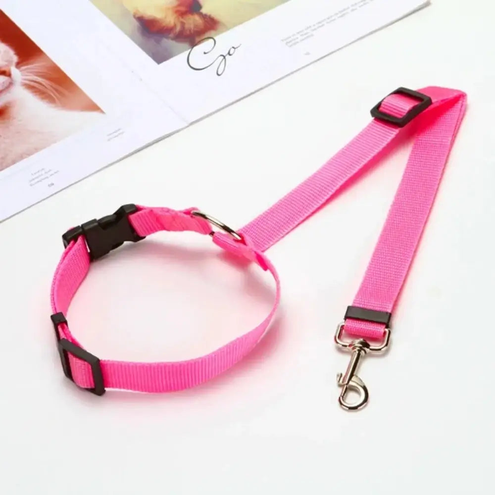 The adjustable pet car seat belt harness for dogs in pink.