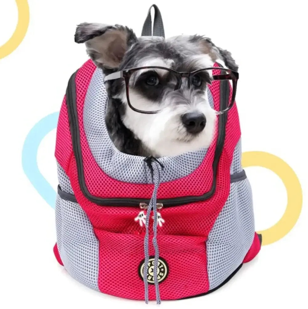 The outdoor portable pet backpack in pink containing a dog wearing glasses.